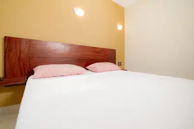 Cama o camas de una habitación en Guitarra Inn