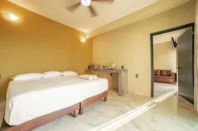 Cama o camas de una habitación en Guitarra Inn