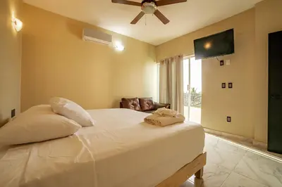 Cama o camas de una habitación en Guitarra Inn