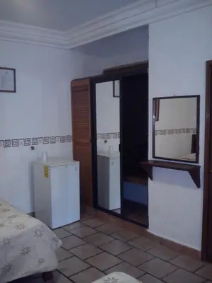 Cama o camas de una habitación en CasaGrande Posada Ejecutiva