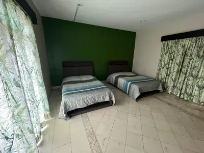 Cama o camas de una habitación en Agradable Habitación Ojo de agua