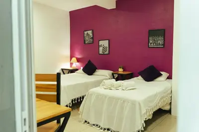 Cama o camas de una habitación en Casa Don José: VIOLETAS Suite