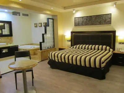Cama o camas de una habitación en Hotel Colonial