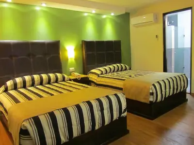 Cama o camas de una habitación en Hotel Colonial