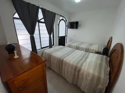 Cama o camas de una habitación en Casa Tenorio Hospedaje