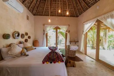 Cama o camas de una habitación en Casa Mariposa Beach Hotel