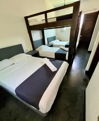 Cama o camas de una habitación en Hotel Aqualuna Departamento #aussiepipe