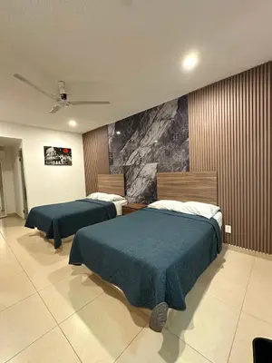 Cama o camas de una habitación en Hotel Boutique Luciérnaga Xochitepec