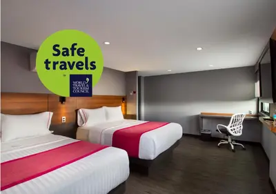 Cama o camas de una habitación en Hotel MX aeropuerto CDMX, Trademark Collection by Wyndham