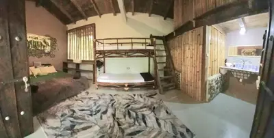 Cama o camas de una habitación en AQUA CEIBA Hotel Spa Aventuras y Eventos