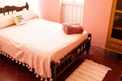 Cama o camas de una habitación en Cozy Refuge 3 Bd house steps from Santo Domingo