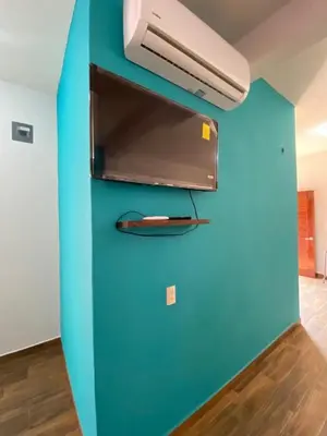 Una televisión o centro de entretenimiento en Casa Suites Minizoo