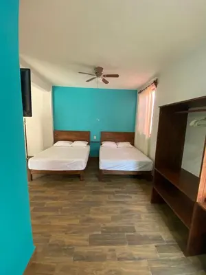 Cama o camas de una habitación en Casa Suites Minizoo