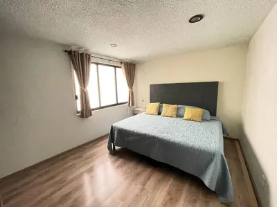 Cama o camas de una habitación en Departamento con estacionamiento Del Valle