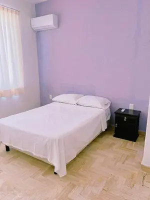 Cama o camas de una habitación en Tiki’s Penth