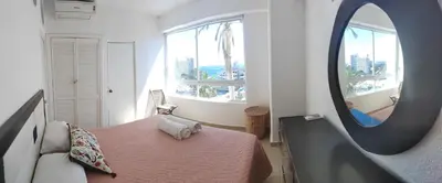 Cama o camas de una habitación en Departamento con vista al mar, albercas y juegos