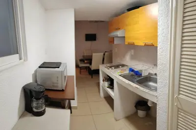 Una cocina o zona de cocina en Departamento con vista al mar, albercas y juegos