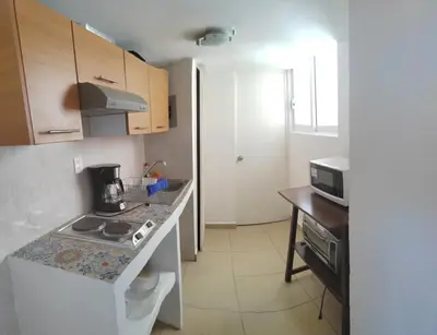 Una cocina o zona de cocina en Departamento con vista al mar, albercas y juegos