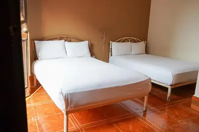 Cama o camas de una habitación en OYO Hotel El Conquistador