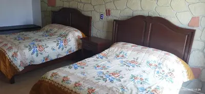 Cama o camas de una habitación en Hotel Sevilla Perote