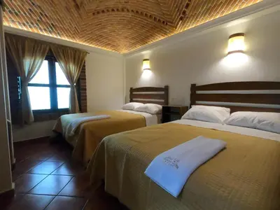 Cama o camas de una habitación en Hotel Santa Irene
