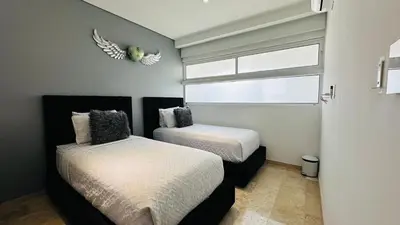 Cama o camas de una habitación en Departamento frente a la bahía