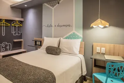 Cama o camas de una habitación en One Coatzacoalcos Forum