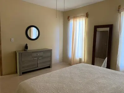 Cama o camas de una habitación en Departamento completo, cómodo y cerca del aeropuerto