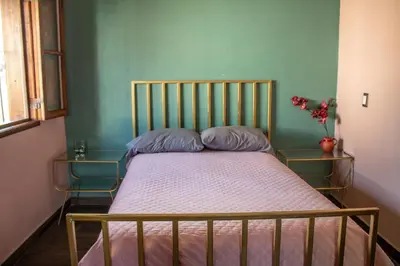 Cama o camas de una habitación en Casa en el centro de Taxco con alberca.