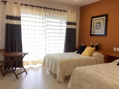 Cama o camas de una habitación en Super casa, la mejor vista de Huatulco