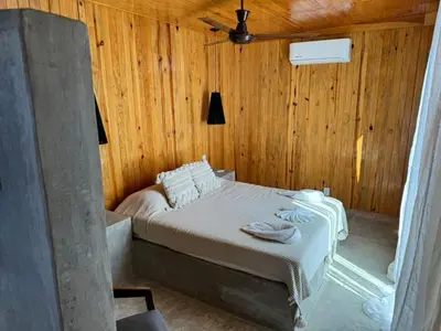 Cama o camas de una habitación en Naari Cabañas Boutique