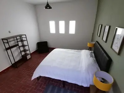 Cama o camas de una habitación en Residencial Oaxaca Centro