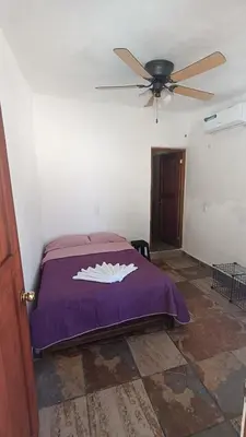 Cama o camas de una habitación en Casa Rústica, Sofía, Frente al mar en Puerto Arista