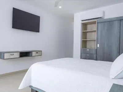 Una televisión o centro de entretenimiento en Casa Xtao Hotel