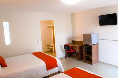 Cama o camas de una habitación en La Casa del Reloj - Zona de Hospitales