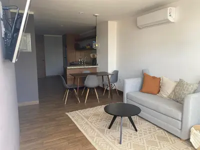 Zona de estar de Modernos departamentos tipo LOFT a dos calles del estadio