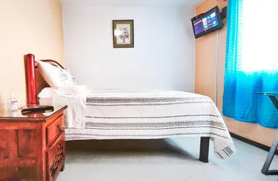 Cama o camas de una habitación en Cozy bedroom at 5 min Mexico City Airport T1 & T2