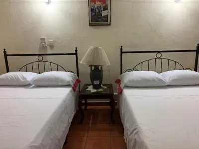 Cama o camas de una habitación en Hotel Jacaranda