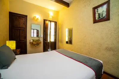 Cama o camas de una habitación en Collection O Al otro lado del rio, Puebla