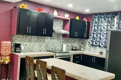 Una cocina o zona de cocina en Villa De Santos Acapulco Playa Bonfil Alberca