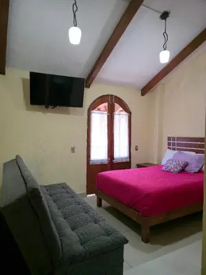 Cama o camas de una habitación en HOTEL PUEBLO BONITO
