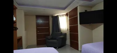 Una televisión o centro de entretenimiento en HOTEL PUEBLO BONITO