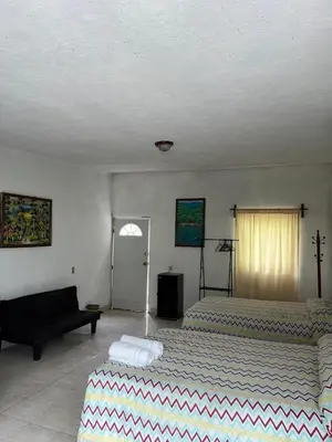 Cama o camas de una habitación en Teques inn