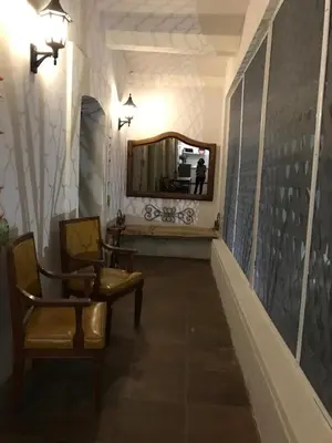 Una televisión o centro de entretenimiento en Hermosa Hacienda Las Heliconias