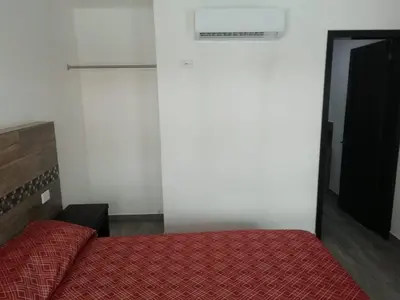 Cama o camas de una habitación en HOTEL QUINTERO