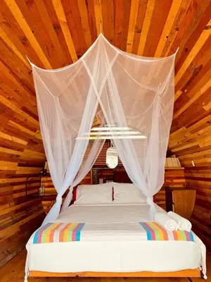 Cama o camas de una habitación en HOTEL EXTASIS ZIPOLITE nudista en zona de fiesta