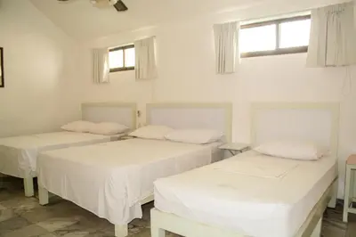 Cama o camas de una habitación en Hotel Olinalá Diamante