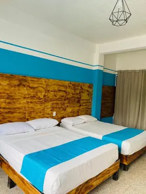 Cama o camas de una habitación en Hotel Lu Acapulco