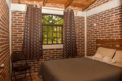 Cama o camas de una habitación en Cabañas De la Vega