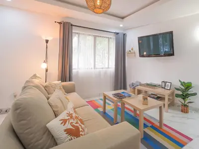 Una televisión o centro de entretenimiento en Casa Coral